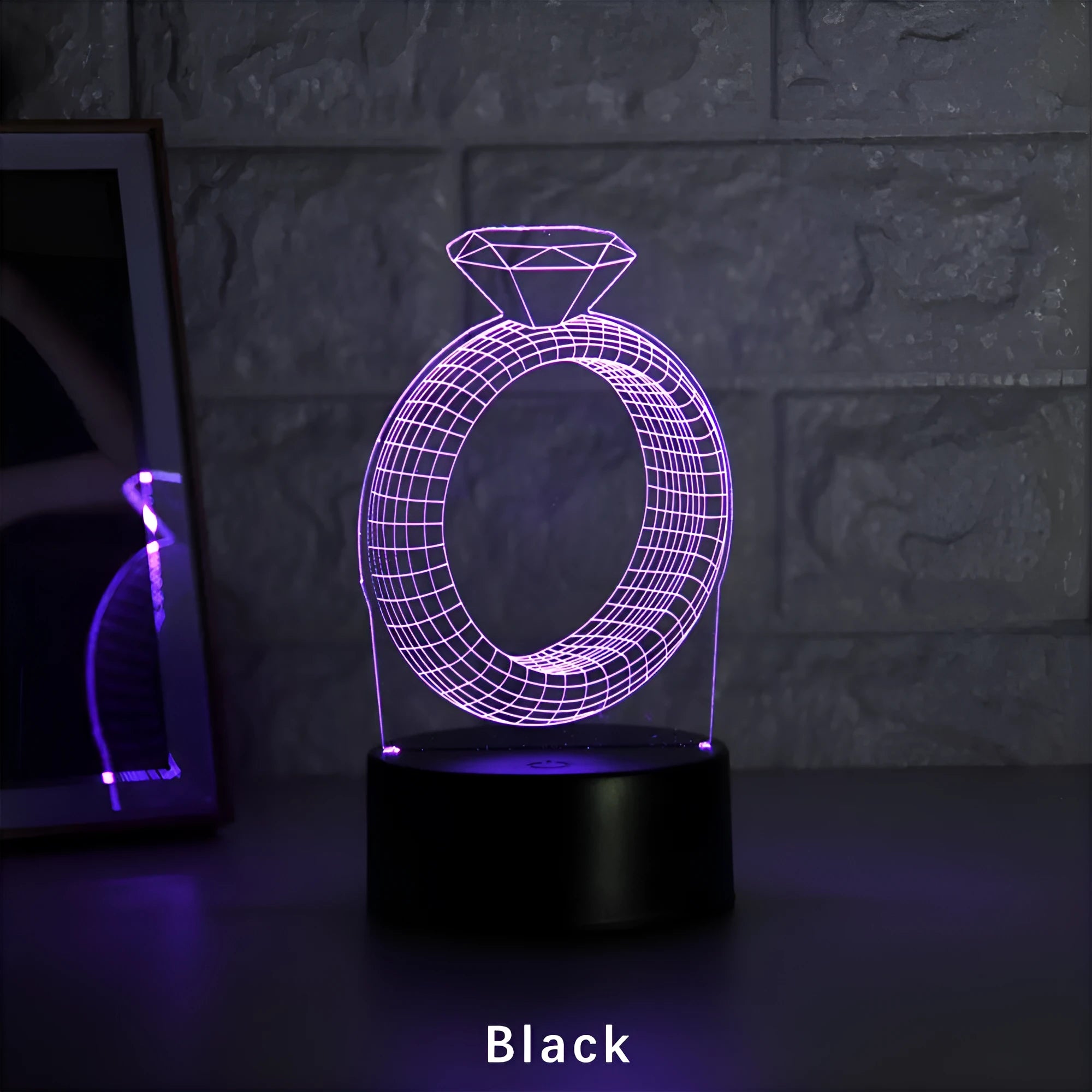 3D LED night light showing illuminated diamond ring design on black base with colour-changing glow