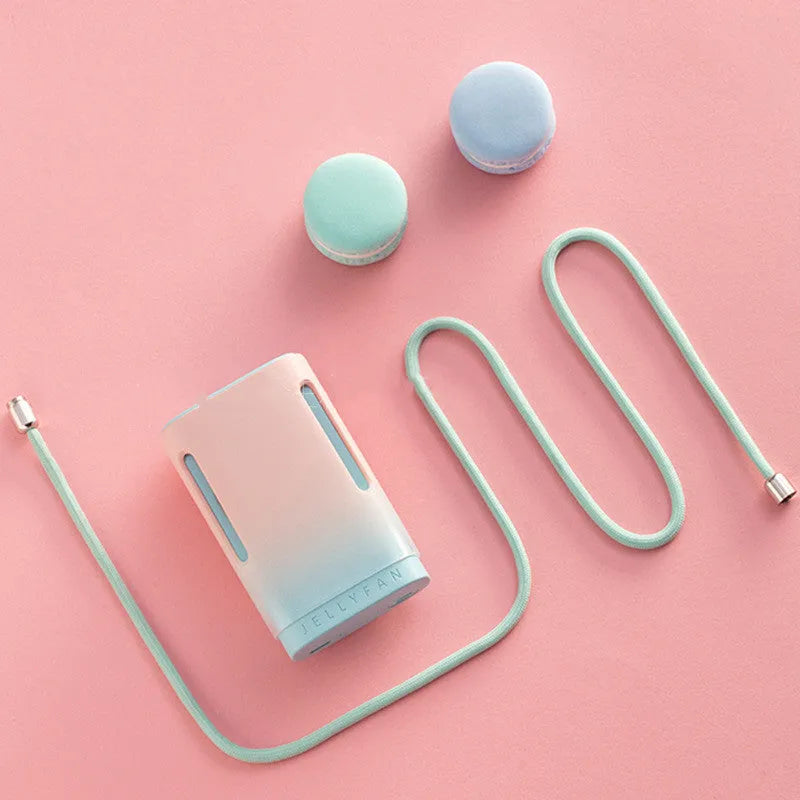 Jelly USB rechargeable hanging neck fan in mint peach colour with webbing strap