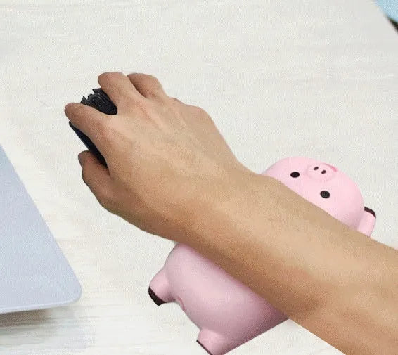 Black single-sided PU wristband mouse pad with integrated wrist rest on a desk.