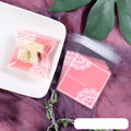 Pink self-adhesive plastic bag with gusseted base for packaging handmade soap