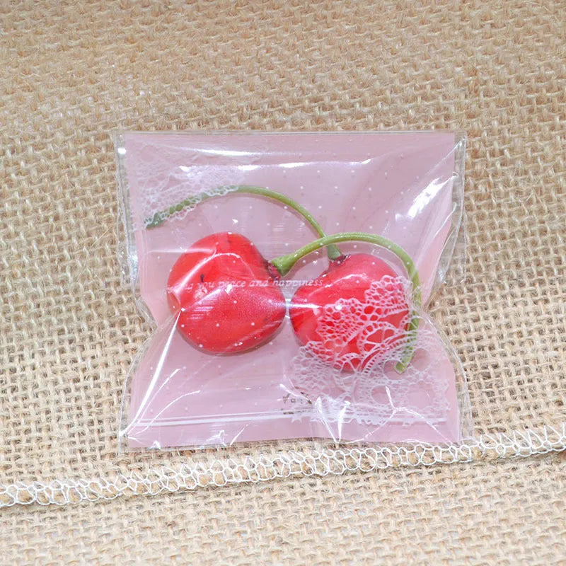 Pink self-adhesive plastic bag with gusseted base for packaging handmade soap