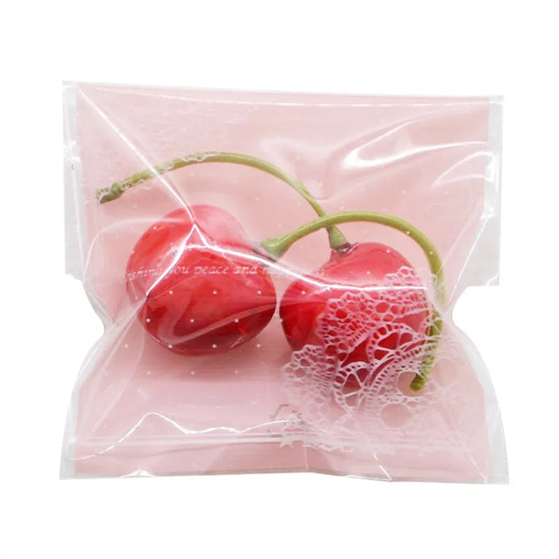 Pink self-adhesive plastic bag with gusseted base for packaging handmade soap