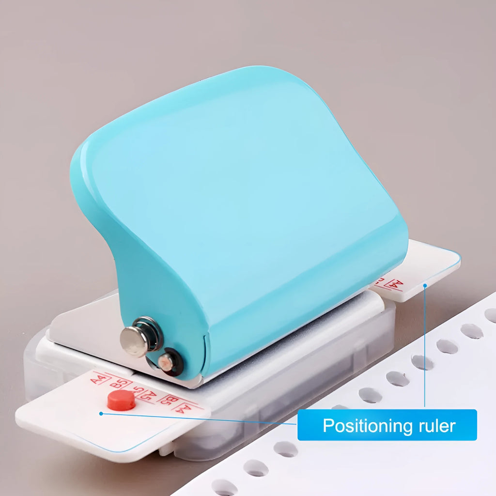 A4 manual punch and binder in sky blue with dimensions 120x55x65mm on a desk