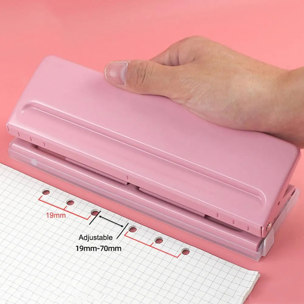 A4 manual punch and binder in sky blue with dimensions 120x55x65mm on a desk