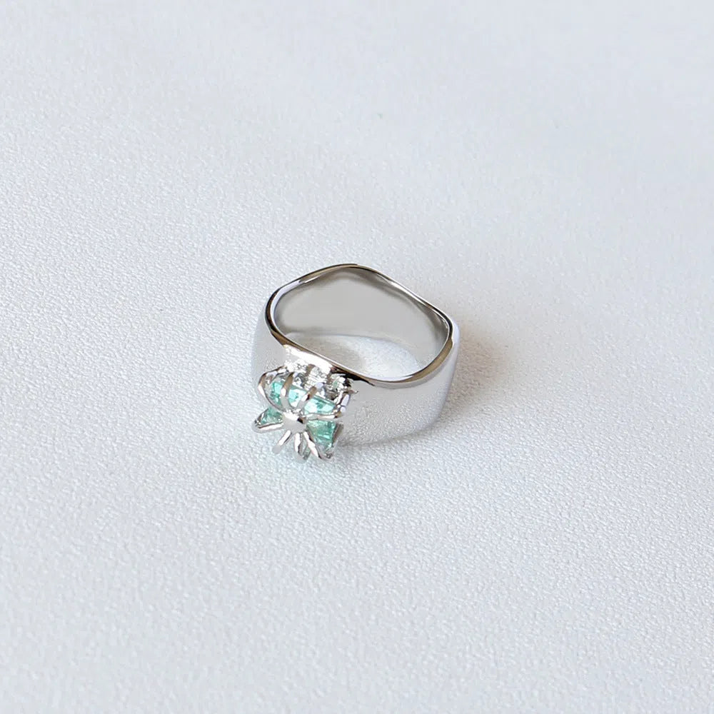 Copper platinum plated couple ring with three-ring gem design in style A on a neutral background