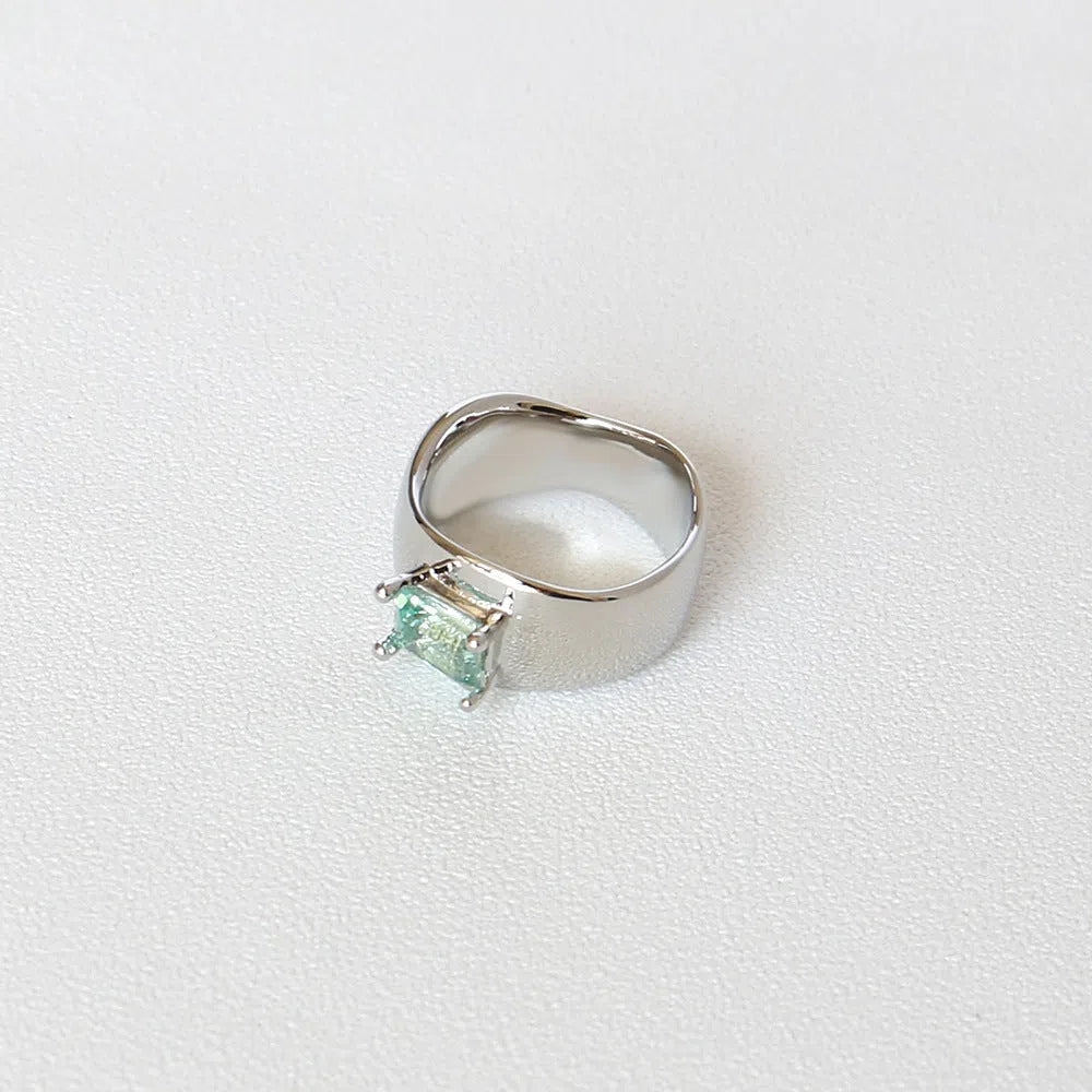 Copper platinum plated couple ring with three-ring gem design in style A on a neutral background