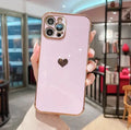 iPhone electroplating love airbag anti-fall protective case in pink TPU material shown on an iPhone 12.