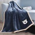 Thick flannel pet sleeping blanket in blue on a sofa with a dog, 100x120cm size