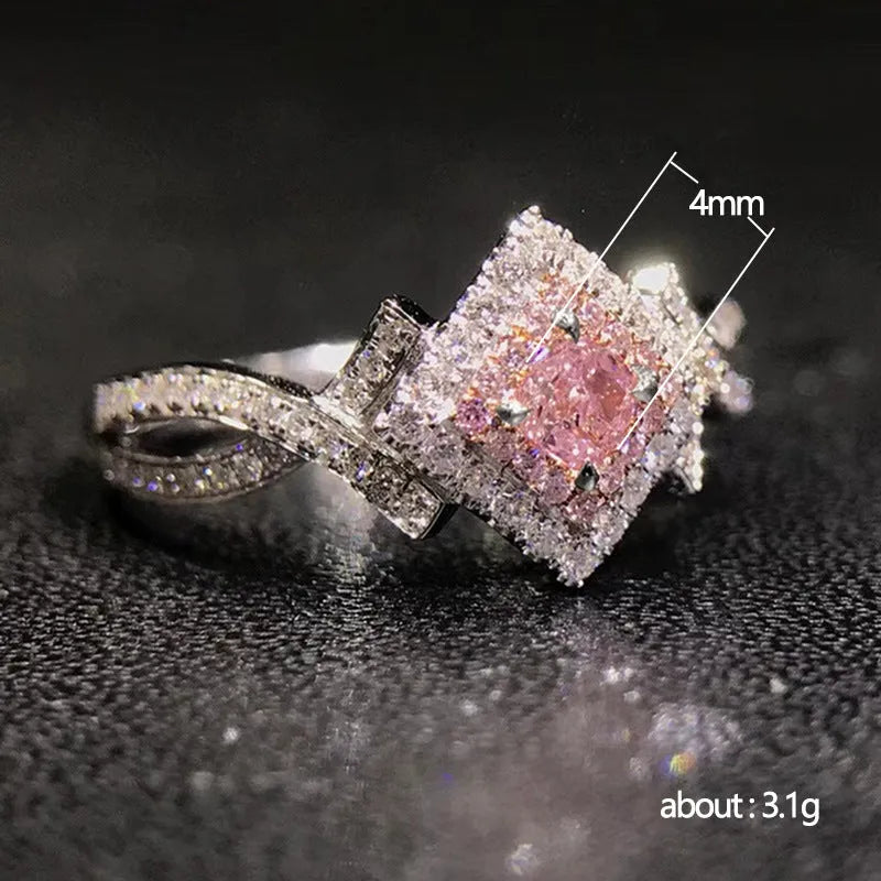 Cross-wound pink zircon ring in copper alloy with geometric modelling, ladies' simple style, sizes 6 to 10.