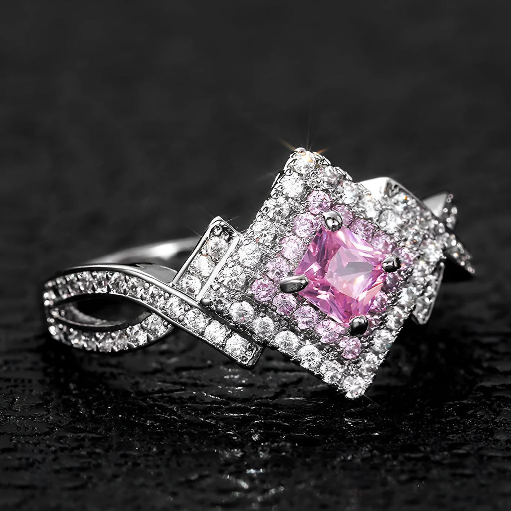 Cross-wound pink zircon ring in copper alloy with geometric modelling, ladies' simple style, sizes 6 to 10.