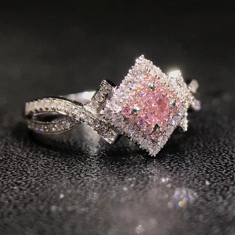 Cross-wound pink zircon ring in copper alloy with geometric modelling, ladies' simple style, sizes 6 to 10.