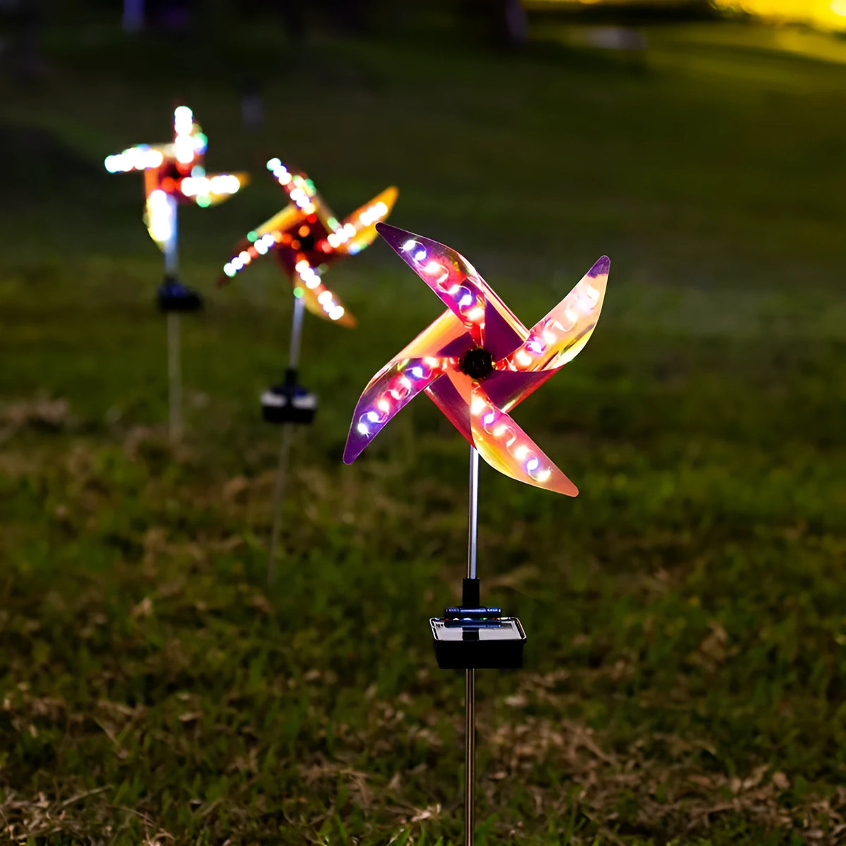 Solar windmill garden light with 32 LEDs, rotating windmill design and built-in solar panel for outdoor decoration