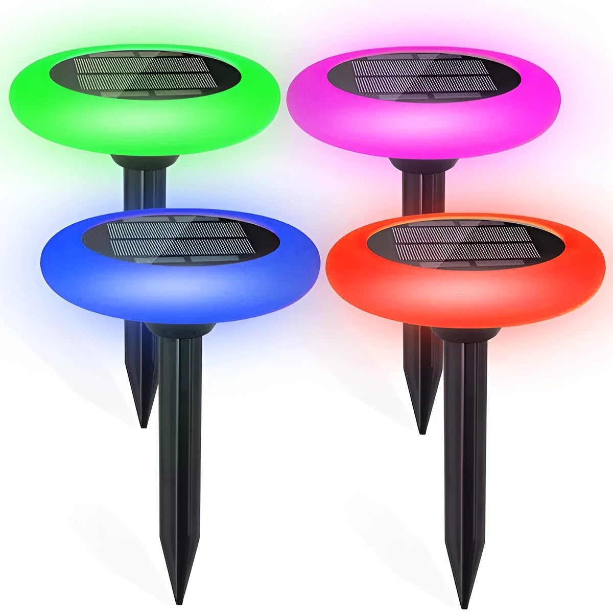 Round solar lawn light with colour gradient finish on garden soil near flowers