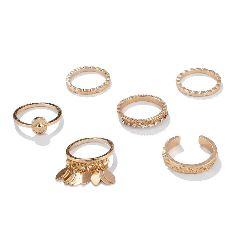 Six-piece golden alloy ring set with geometric leaf tassel design and electroplated finish