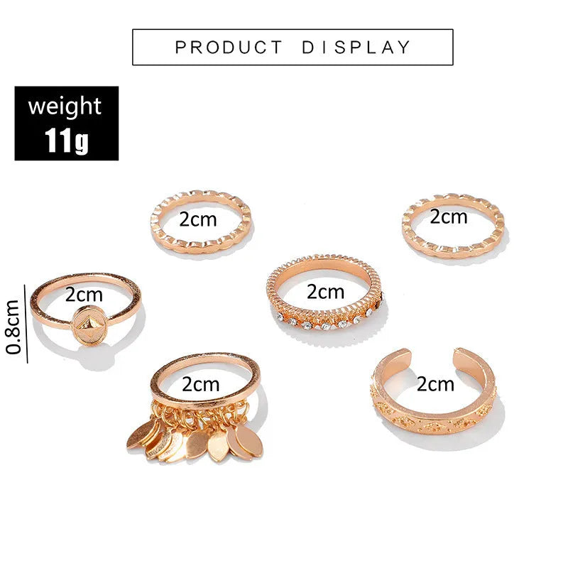 Six-piece golden alloy ring set with geometric leaf tassel design and electroplated finish