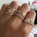Six-piece golden alloy ring set with geometric leaf tassel design and electroplated finish