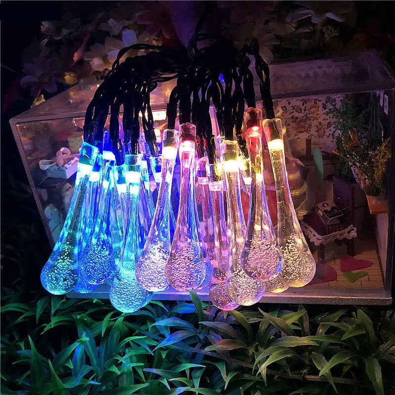 Solar-powered outdoor LED string lights with bubble drop pendants on a 6.5 metre cable.