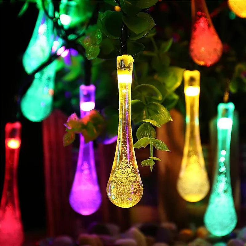 Solar-powered outdoor LED string lights with bubble drop pendants on a 6.5 metre cable.