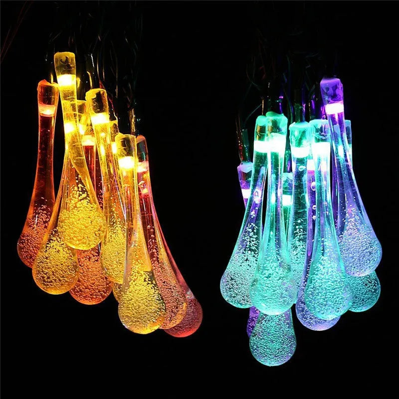 Solar-powered outdoor LED string lights with bubble drop pendants on a 6.5 metre cable.