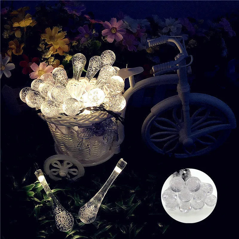Solar-powered outdoor LED string lights with bubble drop pendants on a 6.5 metre cable.