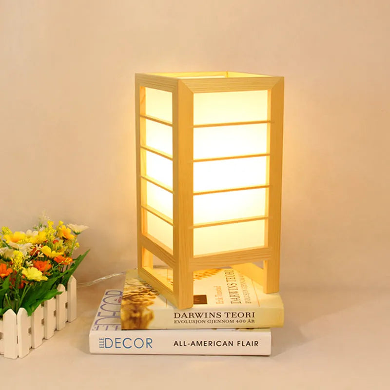 Solid bamboo wood Korean style tatami bedside table lamp on a wooden surface.