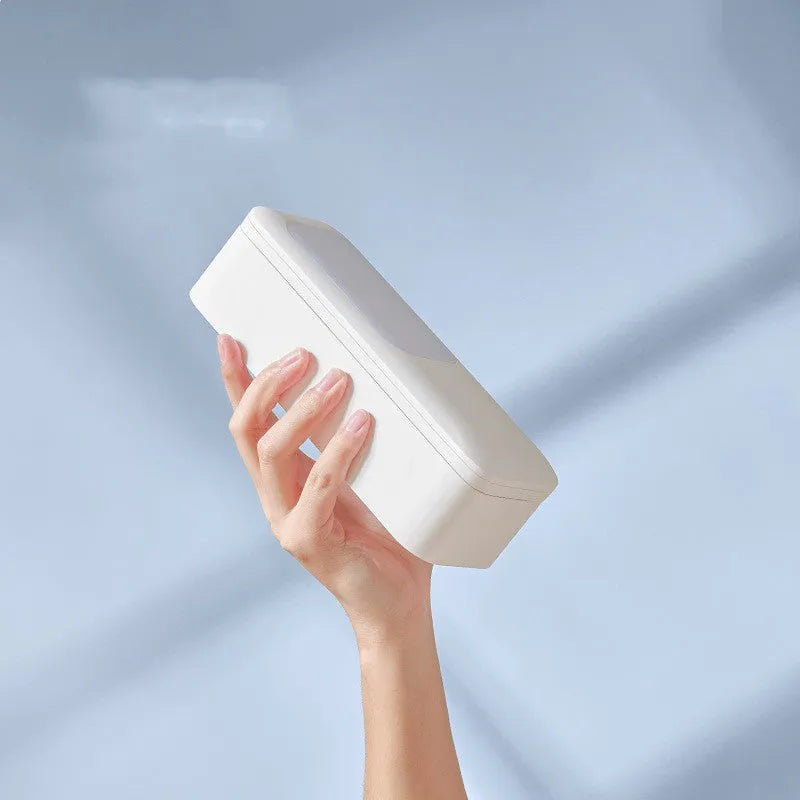 White wireless retractable fill light bracket for smartphone on a desk with LED lighting