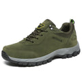 Men's army green low-cut hiking shoes with mesh upper on a neutral background.