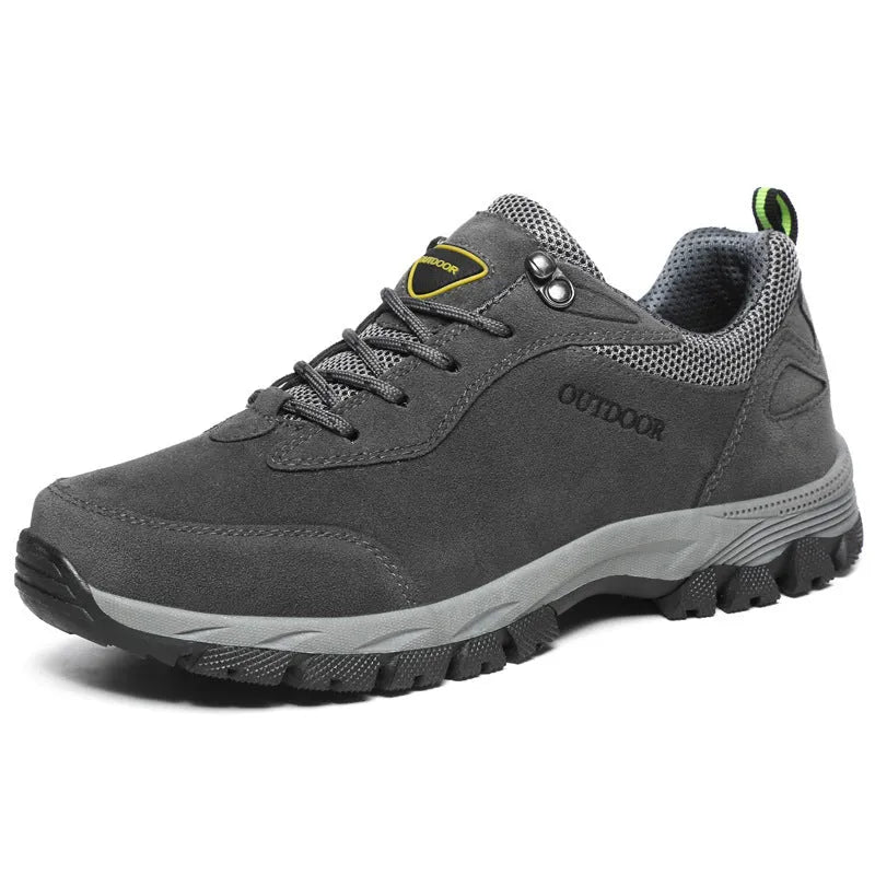 Men's army green low-cut hiking shoes with mesh upper on a neutral background.
