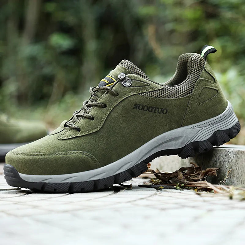 Men's army green low-cut hiking shoes with mesh upper on a neutral background.