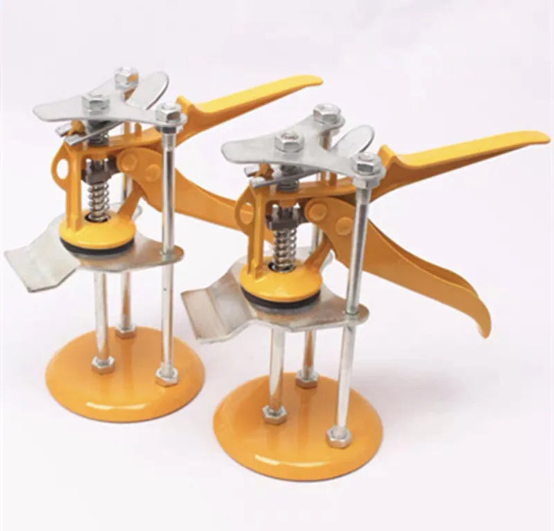 Metal alloy tile raising locator positioner with adjustable height mechanism on a work surface.