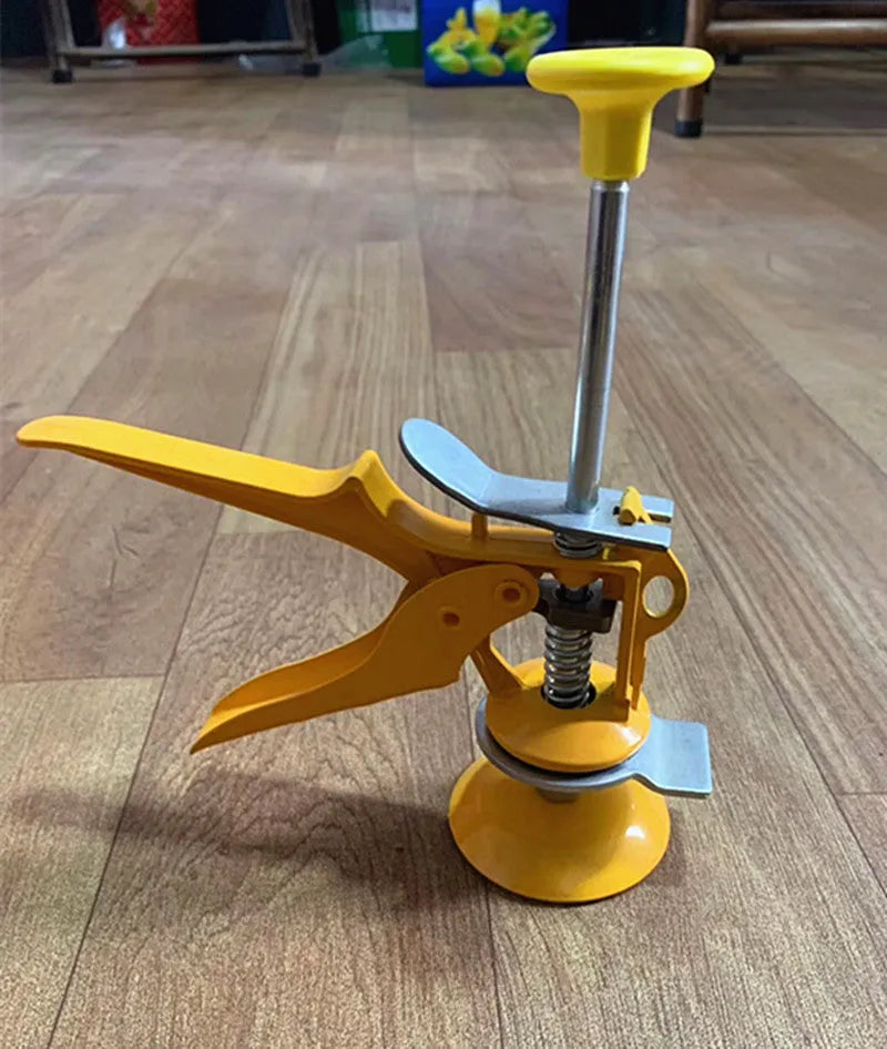 Metal alloy tile raising locator positioner with adjustable height mechanism on a work surface.
