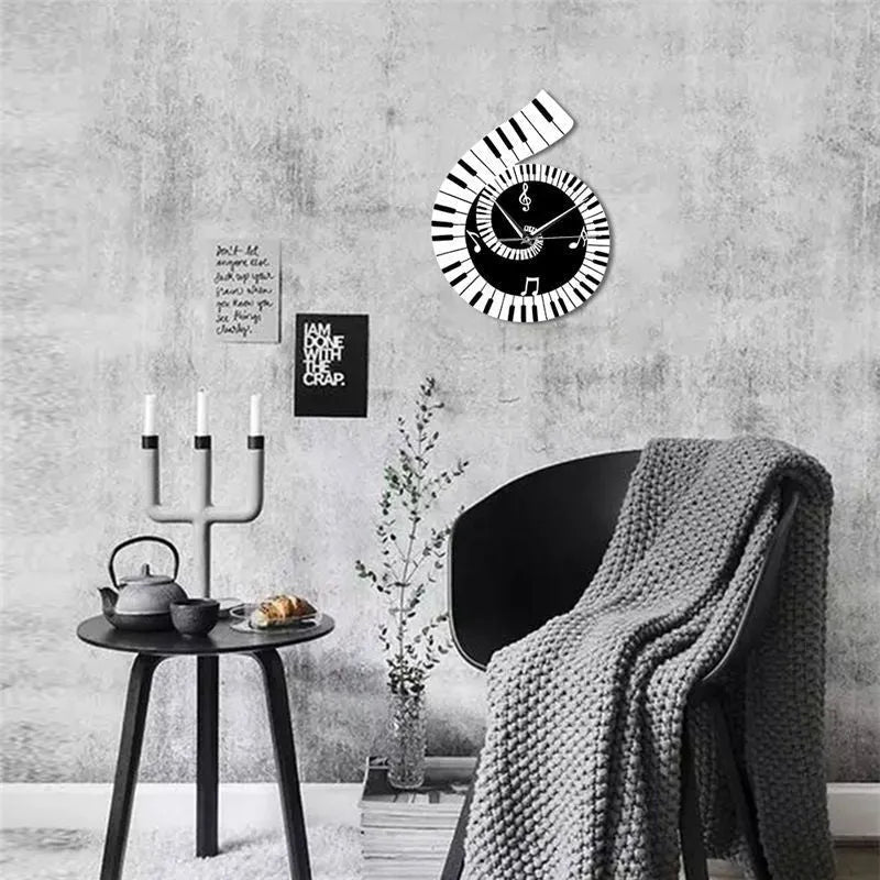 Black and white irregular-shaped wall clock with treble clef and piano keyboard notes design.