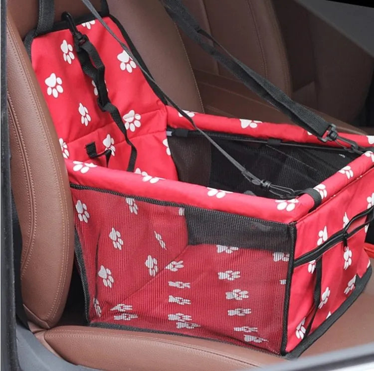 Cloth pet car bag with safety tether shown on a car seat, available in multiple colours and patterns.