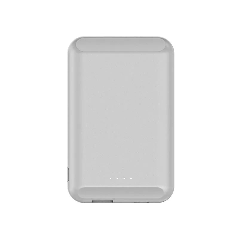 A black magnetic wireless power bank with a 5000mAh capacity, shown attached to a mobile phone.