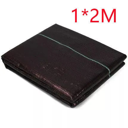 Black composite woven PE weed-proof cloth roll for farmland and greenhouse use.