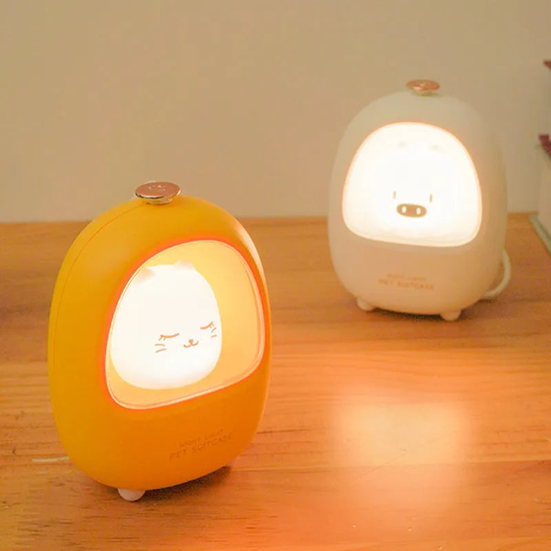 Portable cartoon-designed bedside night light with touch dimming control on a table.