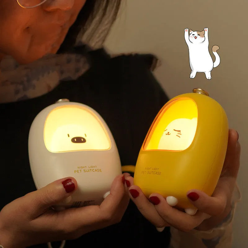 Portable cartoon-designed bedside night light with touch dimming control on a table.