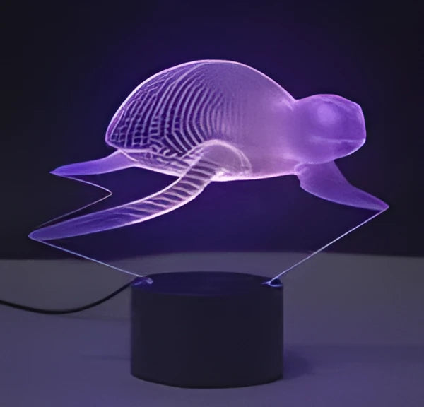 3D LED table lamp with acrylic panel on black ABS base showing multi-colour gradient illumination.