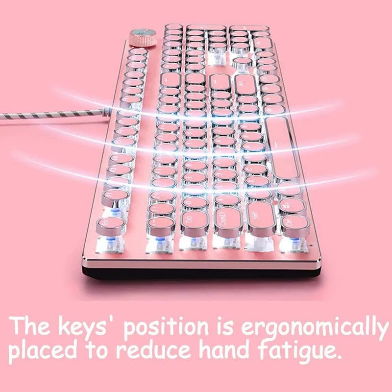 Queen Lipstick mechanical keyboard with silver base, pink keycaps, and green mechanical switches on a desk.