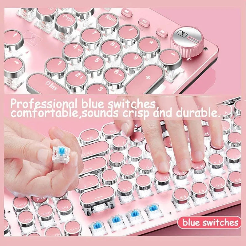 Queen Lipstick mechanical keyboard with silver base, pink keycaps, and green mechanical switches on a desk.
