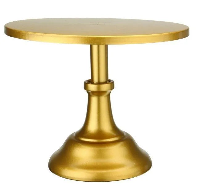 Three-tier metal dessert tray with 25cm plates in gold colour on a table with cupcakes.