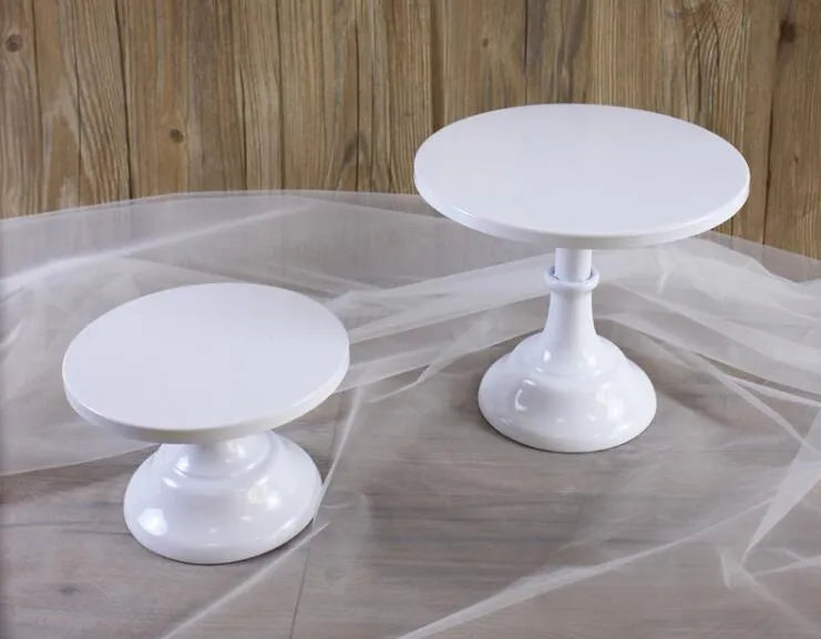 Three-tier metal dessert stand with 25cm trays in gold finish displaying cupcakes and pastries.