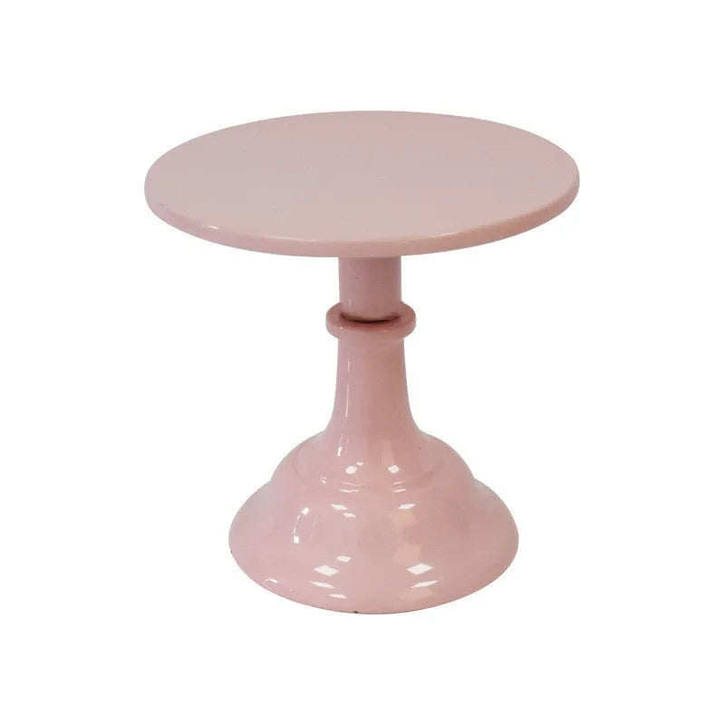 Three-tier metal dessert tray with 25cm plates in gold colour on a table with cupcakes.