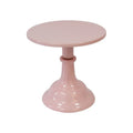 Three-tier metal dessert tray with 25cm plates in gold colour on a table with cupcakes.