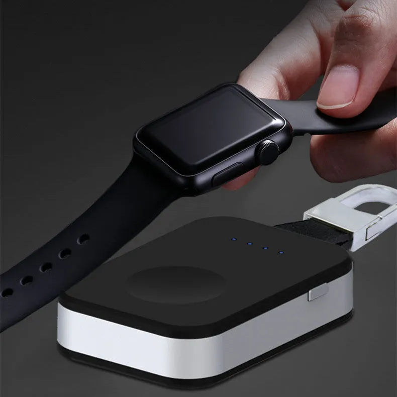 Black portable Apple Watch wireless charging power bank on a keyring.