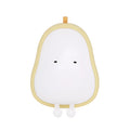 Yali warm yellow silicone pear night light on a wooden bedside table.