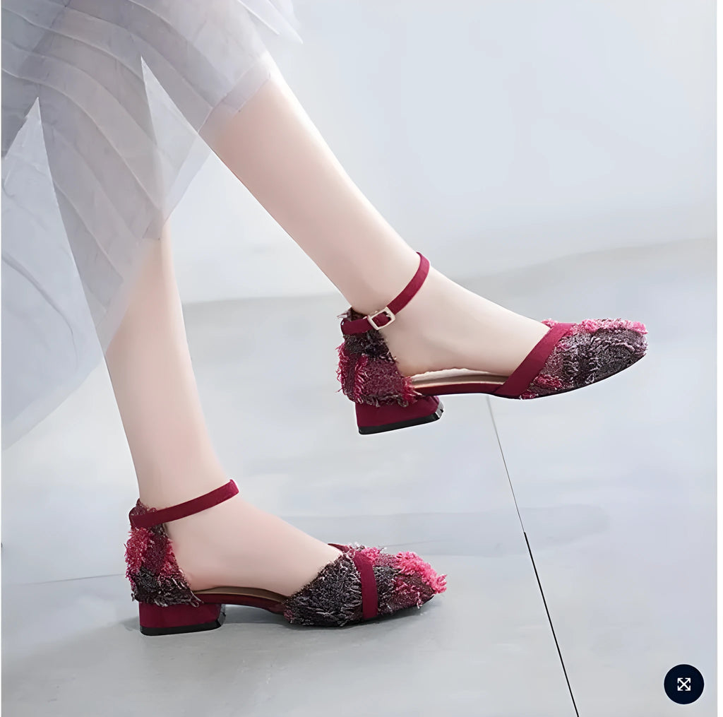 Women's apricot suede ankle-strap Dorsay flats with a 3cm low heel on a wooden surface.