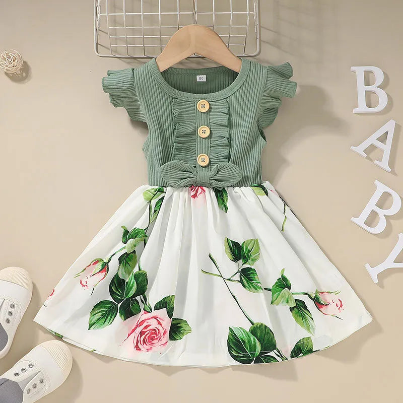 Sleeveless summer dress for toddler girls in green, shown on a hanger.