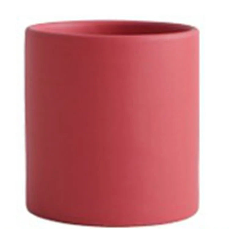 Cylindrical ceramic succulent planter with drainage hole in Nordic style, shown in a selected colour.