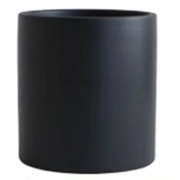 Cylindrical ceramic succulent planter with drainage hole in Nordic style, shown in a selected colour.
